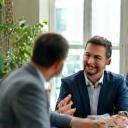 Attorney in discussion with happy business client